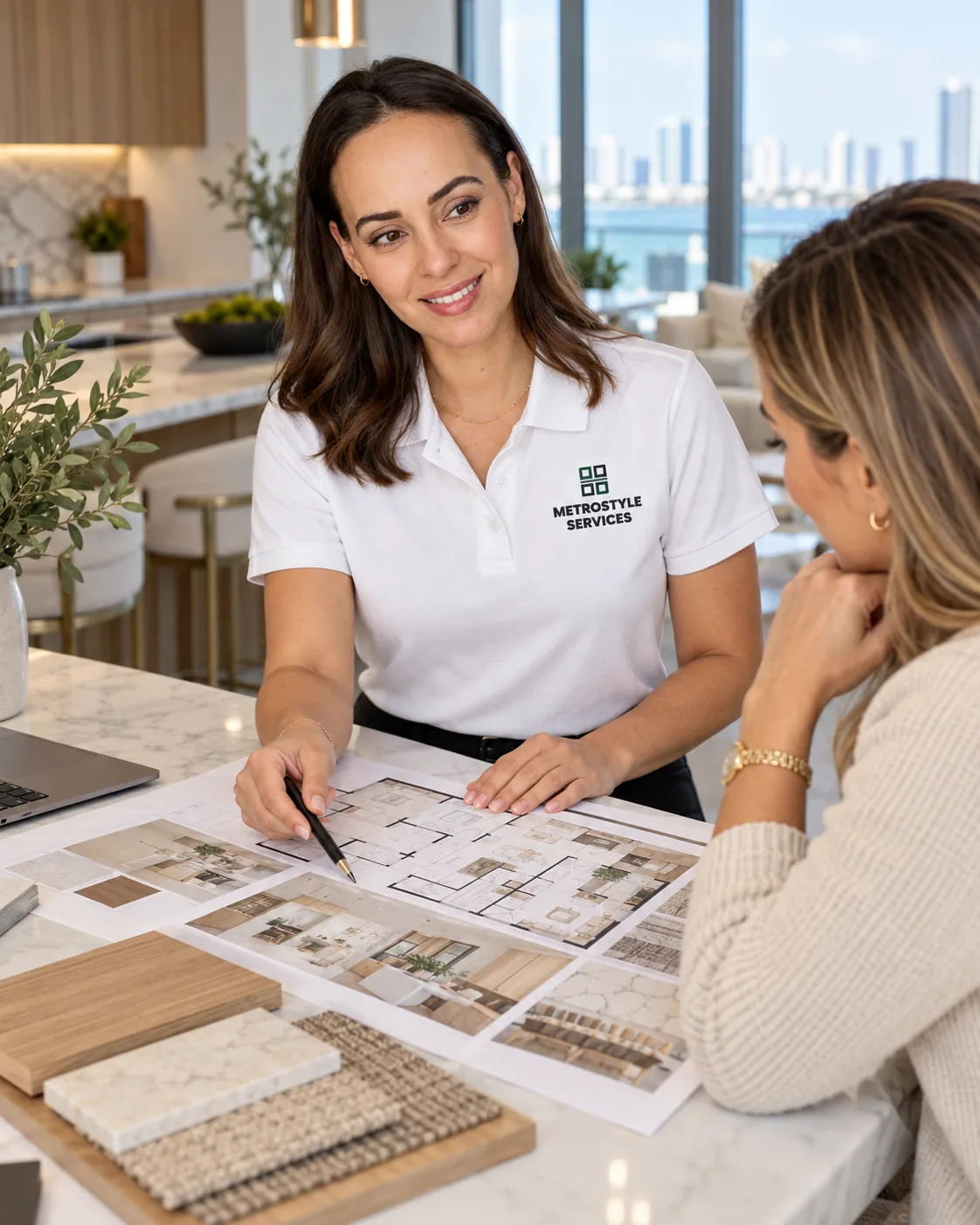 Tina reviewing floor plans and material samples with a homeowner